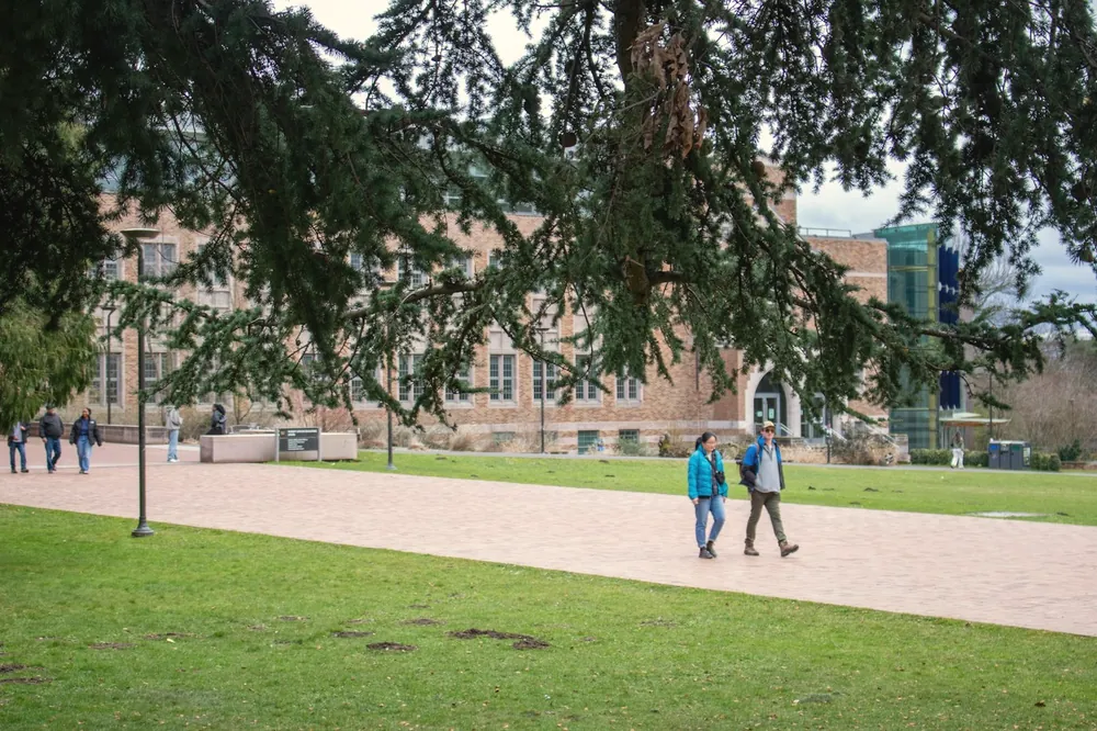 Students walking across a college campus
