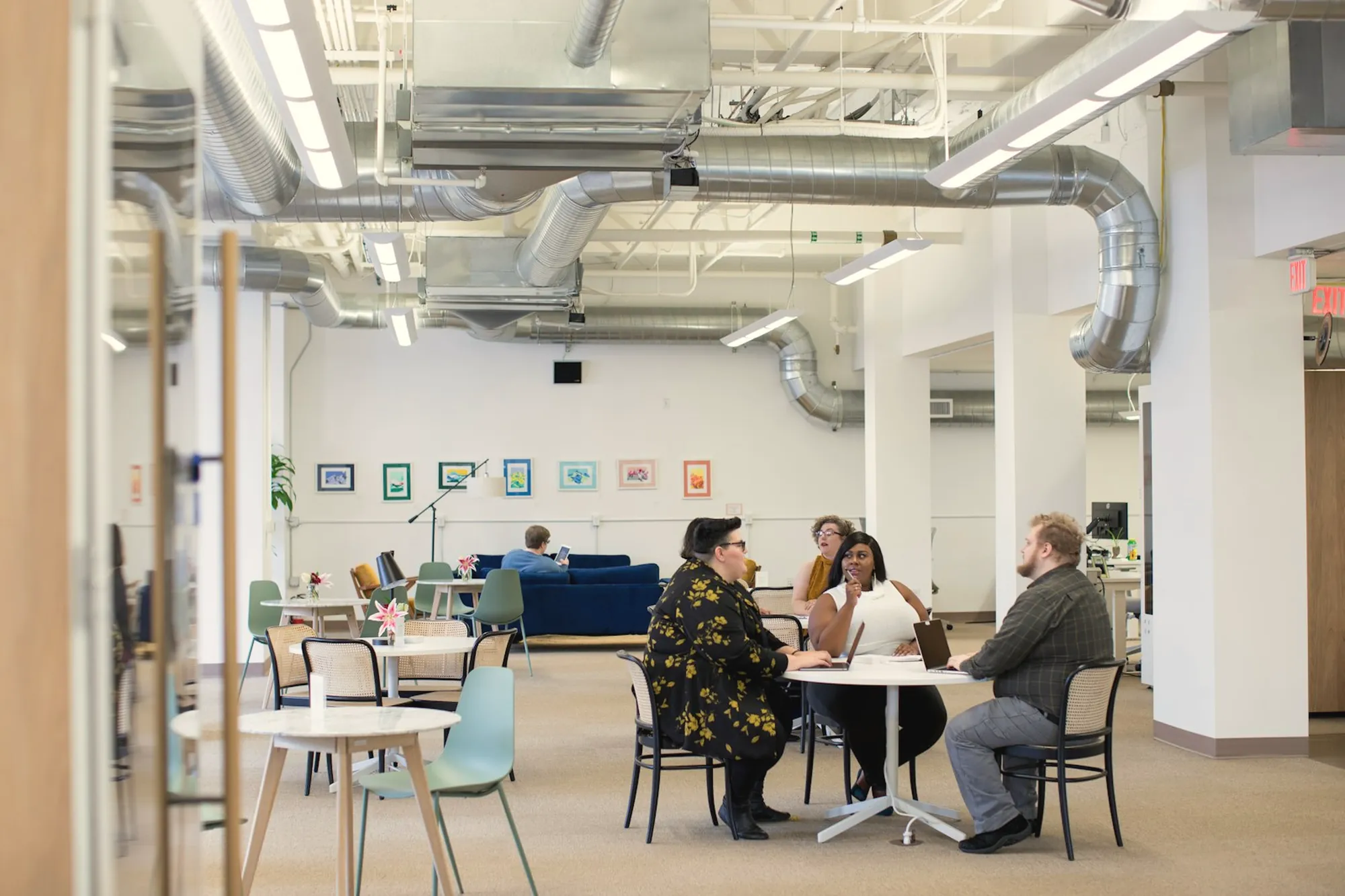 People working together in a bright open office